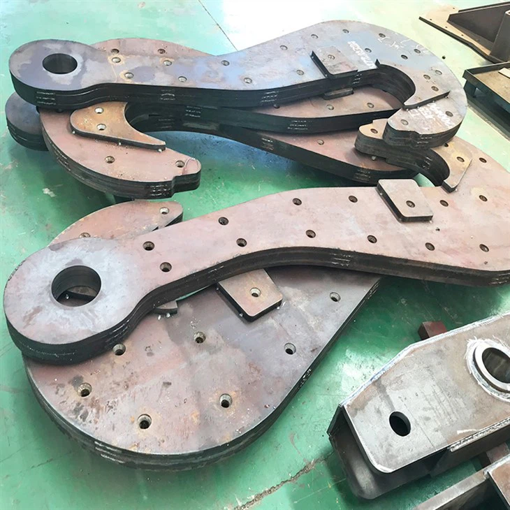 Laminált merőkanál horog